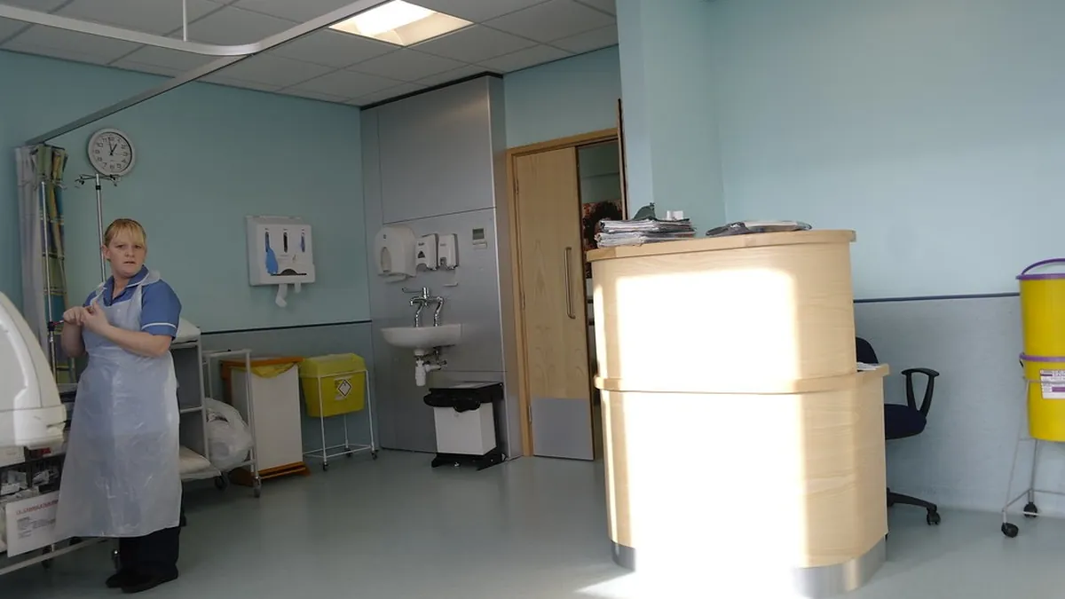 Nurse caring for a patient as part of a coordinated cancer care team