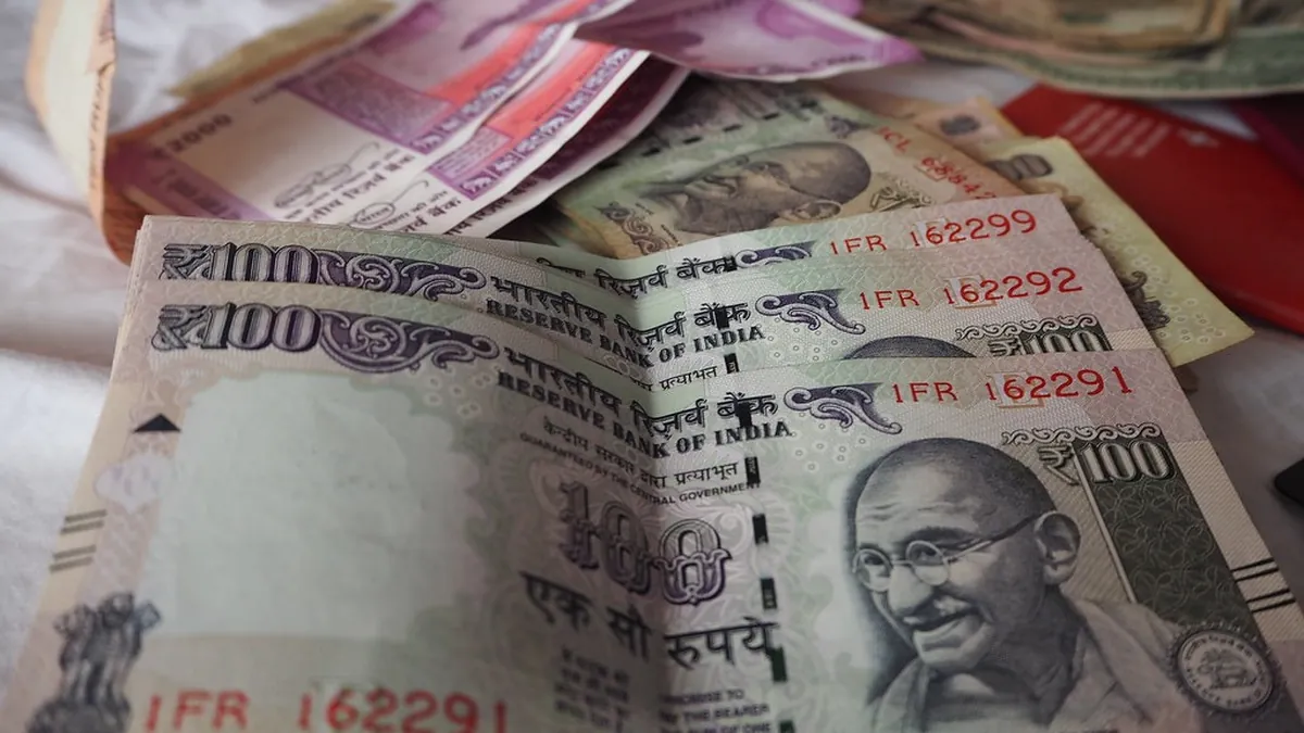 Indian rupee notes representing out-of-pocket cancer treatment expenses