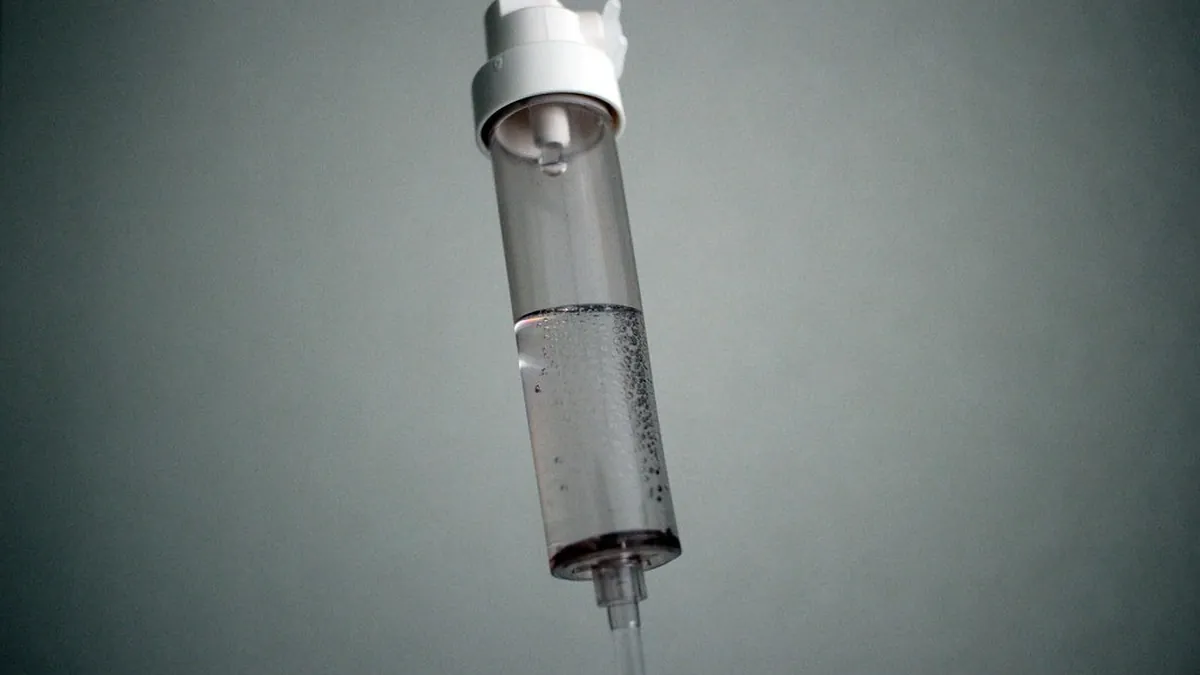 Intravenous drip chamber delivering an infusion during chemotherapy