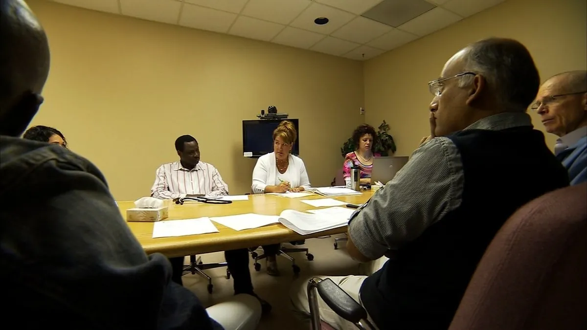 Team of doctors meeting to plan an individualized cancer treatment strategy